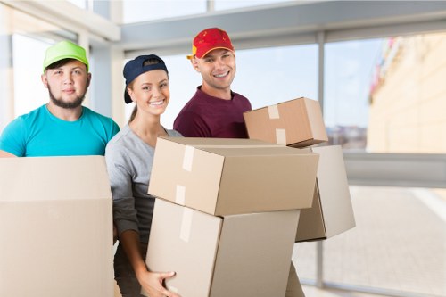 Removal team preparing boxes and equipment with safety focus