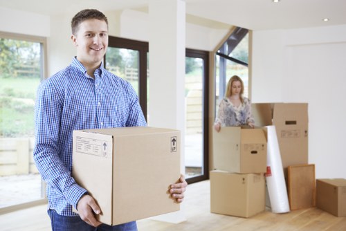 Furniture removal from a home interior with careful loading and access planning
