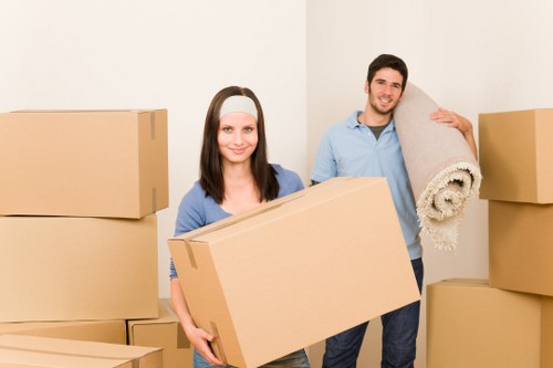 Packed moving boxes and furniture ready for transport by movers