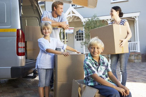 Furniture and boxes being moved into a new local home